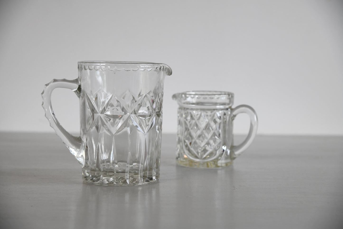 Two Vintage Moulded Glass Jugs