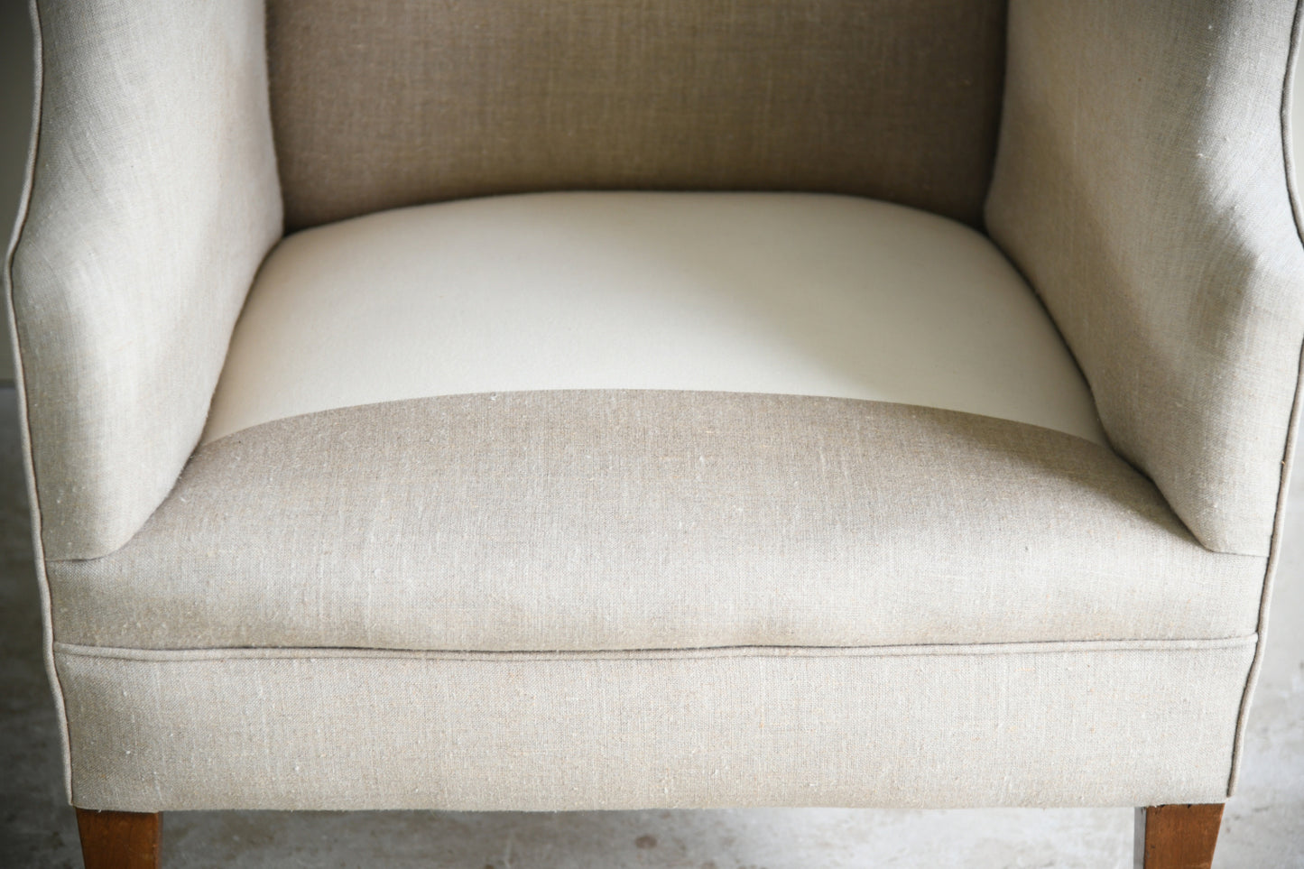 Antique Linen Upholstered Wing Back Armchair