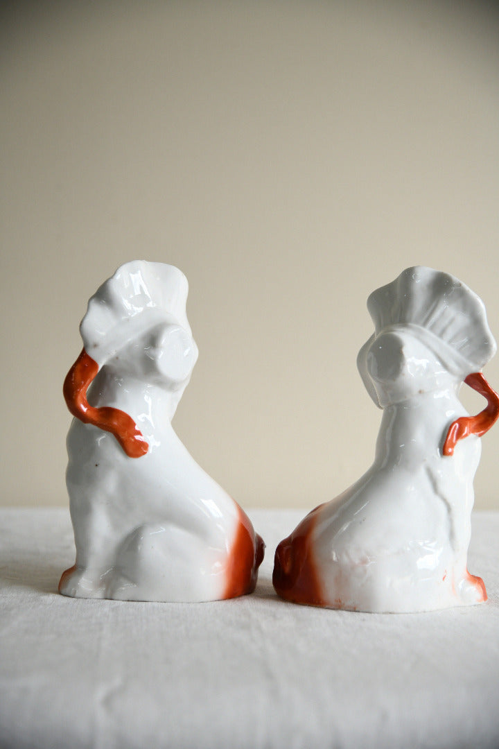 Pair of Vintage Porcelain Dog Figurines in Blue Bonnets