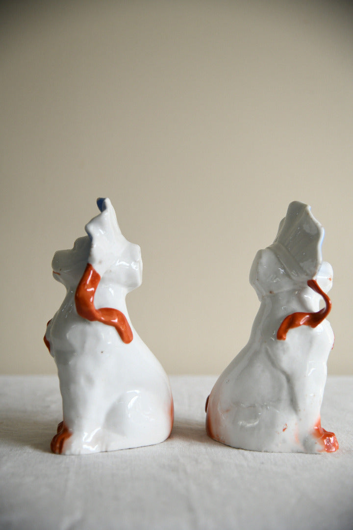 Pair of Vintage Porcelain Dog Figurines in Blue Bonnets