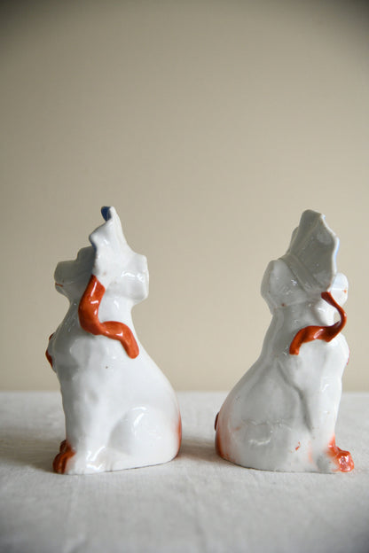 Pair of Vintage Porcelain Dog Figurines in Blue Bonnets