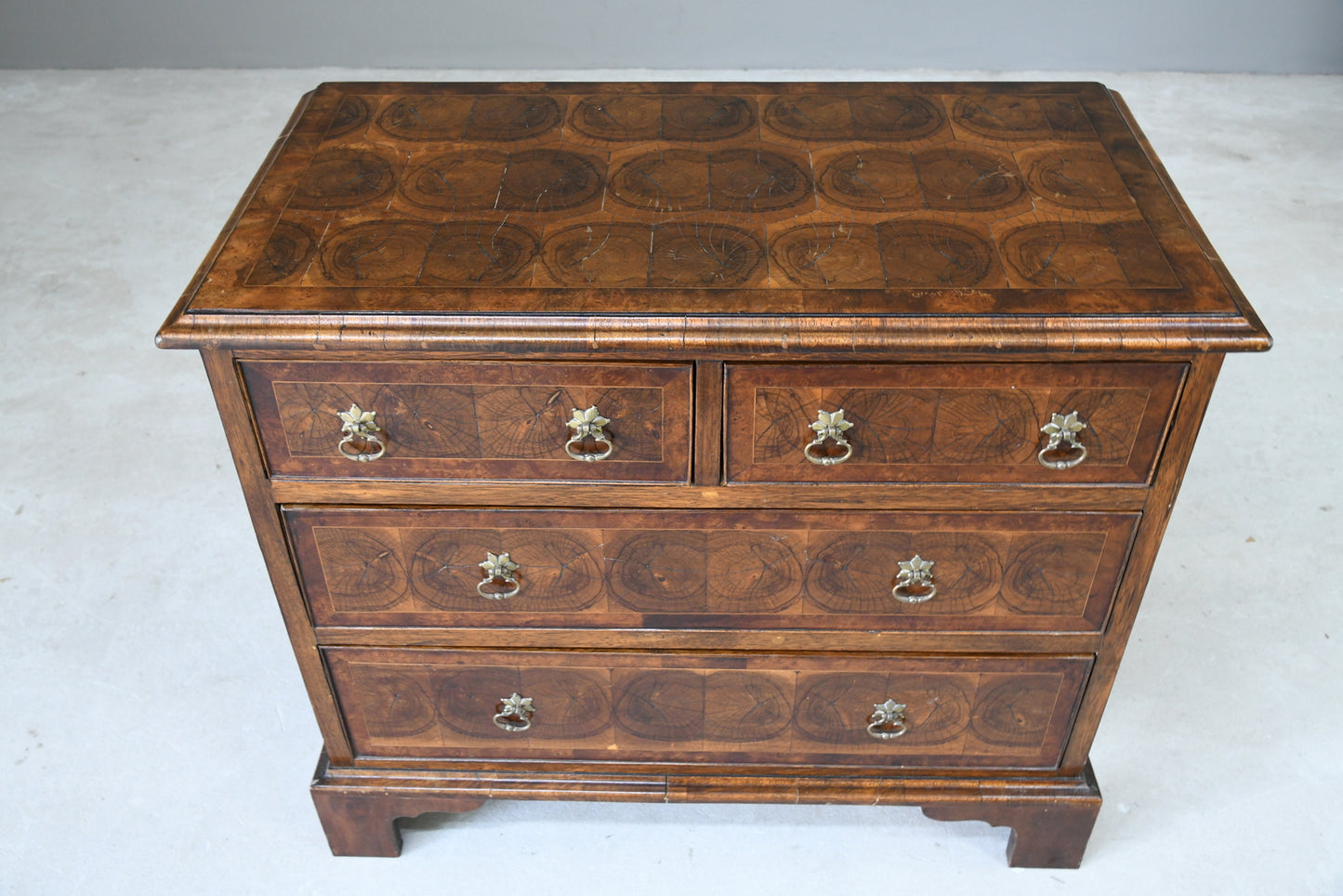 Walnut Oyster Chest of Drawers