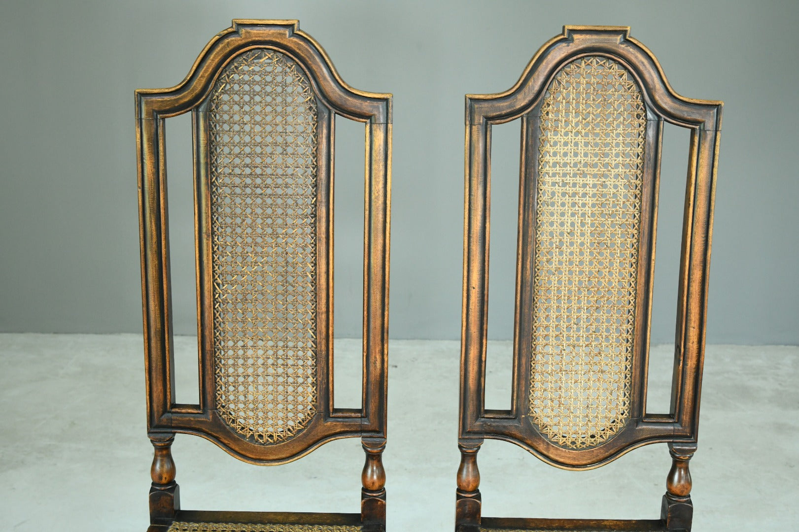 Pair Walnut and Cane Carolean Chairs