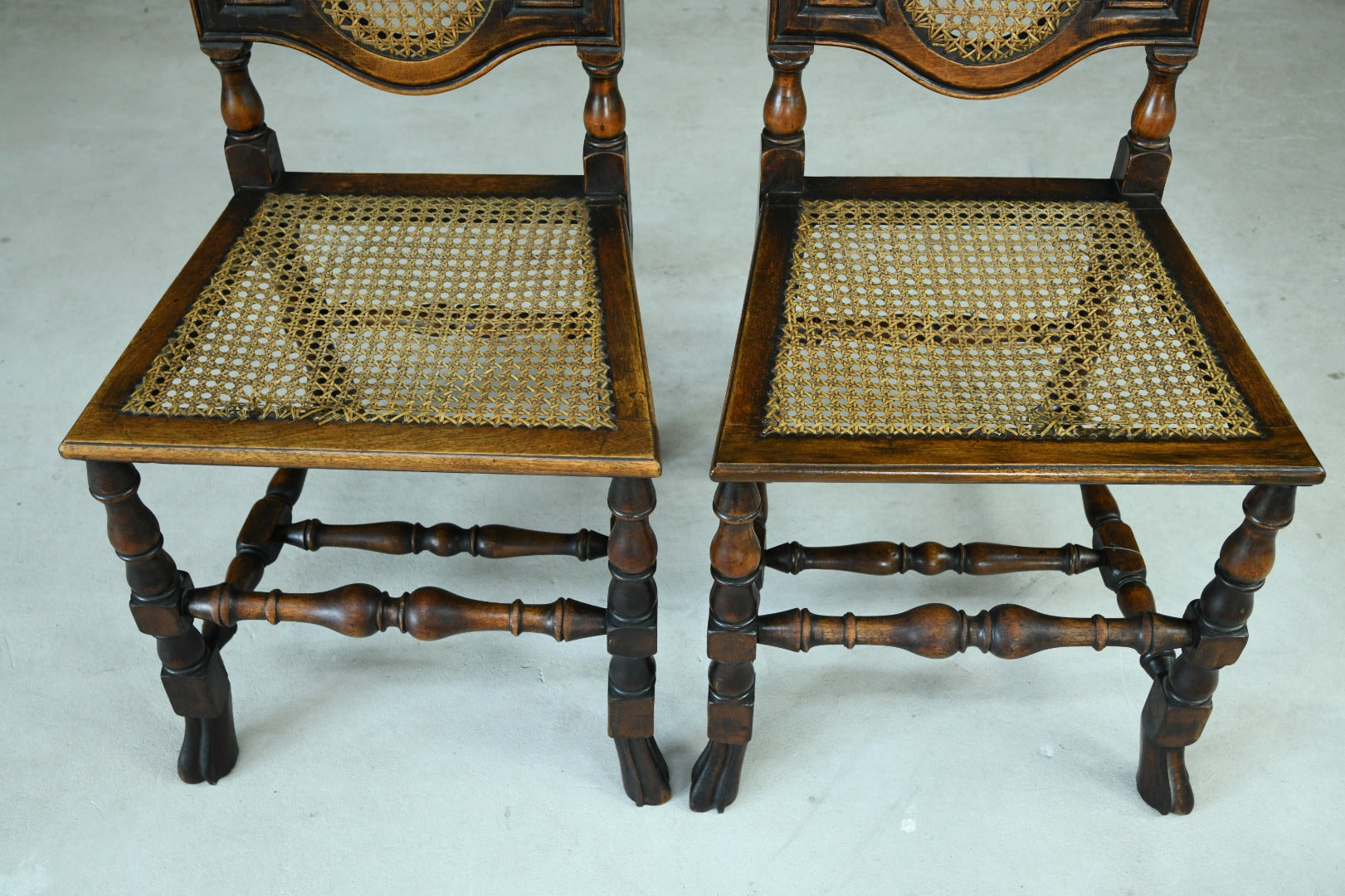 Pair Walnut and Cane Carolean Chairs