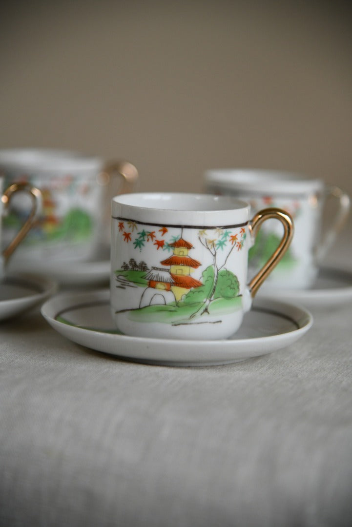 4 Oriental Coffee Cups and Saucers